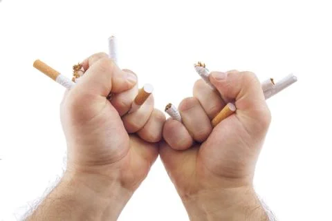 Human hands breaking cigarettes Stock Photos
