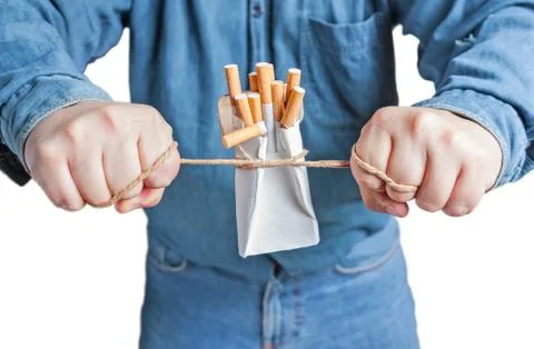 Human hands breaking the pack of cigarettes Stock Photos
