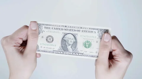 Human hands converting hundred dollar bills manually at white background, Stock-Footage 336260698
