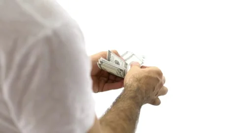 Human hands converting hundred dollar bills manually at white background, Stock-Footage 336261217