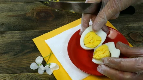 Human hands cut boiled egg. Stock Footage 130410623