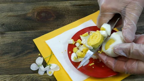 Human hands cut boiled egg. Stock Footage 130411882