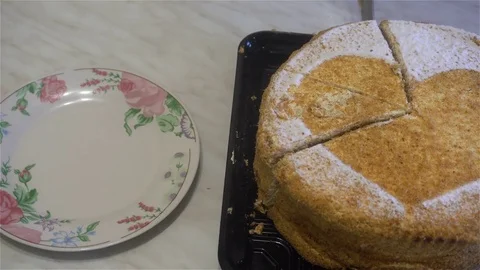 Human hands cut a slice of cake and put it in the plate Video stock 82735264