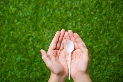 Human hands holding empty spoon Stock Photos