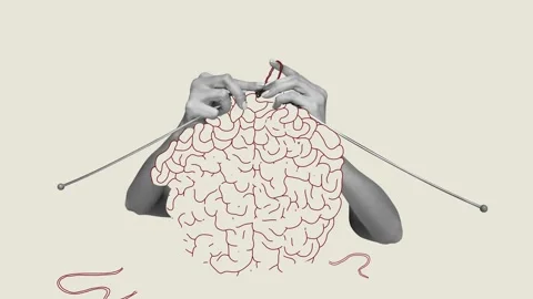 Human hands knitting brain. Growing psychological and emotional stability Stock Footage 236635880