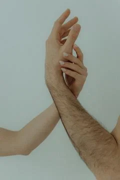 Human hands on a light background. the concept of unity, friendship and love Stock Photos
