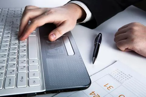 Human hands on the notebook keyboard 2 Stock Photos