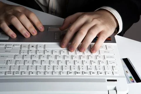 Human hands on the notebook keyboard Stock-Fotos