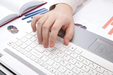 Human hands on the notebook keyboard Stock Photos