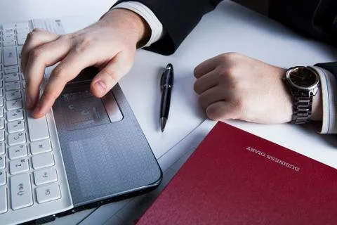 Human hands on the notebook keyboard Stock Photos