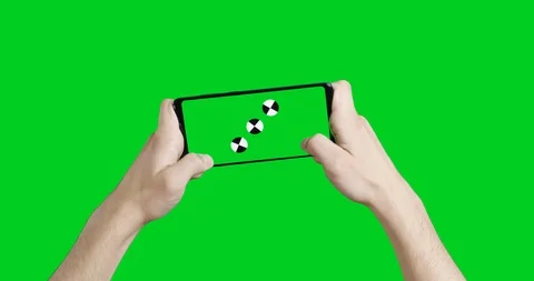 Human hands play on a smartphone with a green screen. footage for advertising Stock Footage 121428225