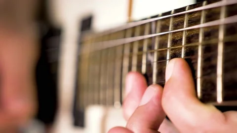Human hands playing on electric guitar Stock Footage 132821207