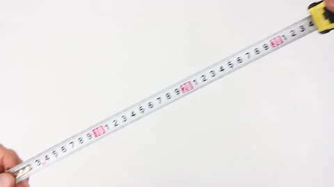 Human hands pull the measuring tape out of tape measure and measure diagonal Video stock 135290800