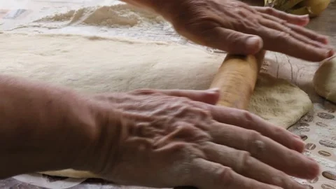Human hands roll out the dough Stock Footage 327582236