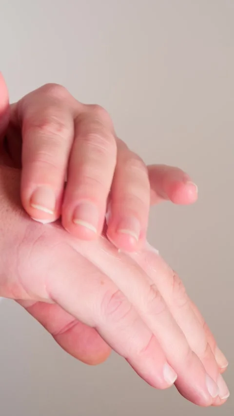 Human hands spreading moisturizing cream Stock Footage 328237427