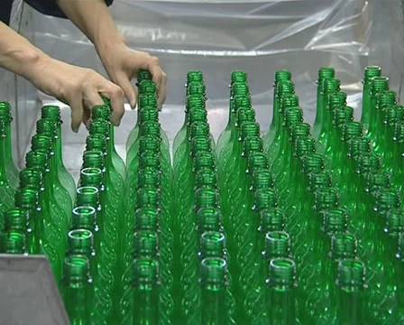 Human hands take green PET bottles. Stock Footage