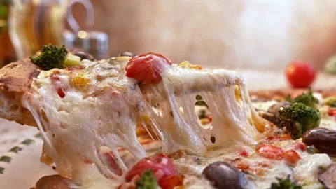 Human hands take slices of hot tasty italian pizza from open box, party food Video stock 336586665