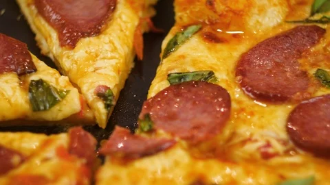 Human hands taking pieces slices of hot tasty italian pizza from open box, close Stock Footage 105894700