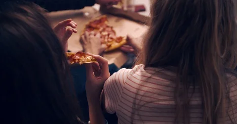 Human hands taking pieces slices of hot tasty italian pizza from open box, food Stock Footage 129580840