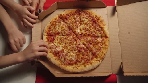 Human hands taking slices of hot tasty italian pizza from open box, food Video stock 120165839