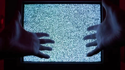 Human Hands Touching Grainy Static Noise on an Old Retro Crt Television Display Stock Footage 335635067