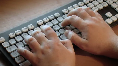 Human hands typing on a computer keyboard Stock Footage 68189561