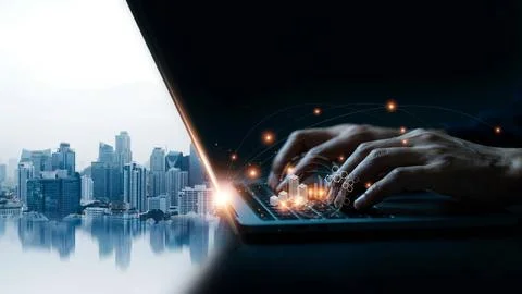 Human hands typing on a laptop keyboard with digital city skyline hologram .. Stock Illustration