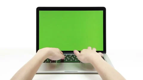 Human hands typing laptop notebook with green screen on white background. Stock Footage 50856473