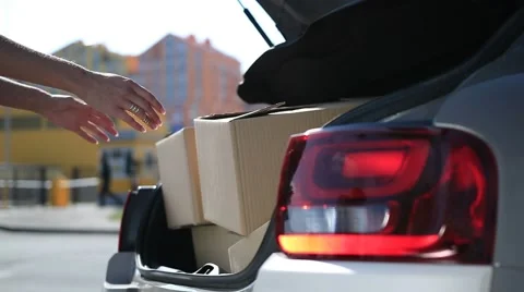 Human hands unloading cardboard boxes from car Video stock 68014992