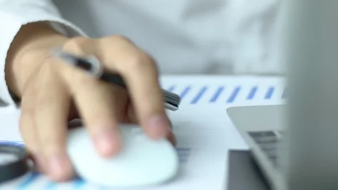 Human hands using a computer mouse on a desk, a businessman working Stock Footage 87657049