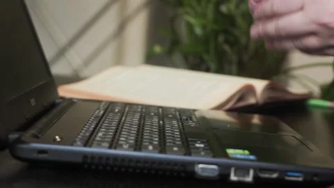 Human hands wipe a laptop keyboard before work with a wet bactericidal cloth. Stock Footage 130741193