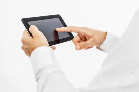 Human hands working on digital tablet Stock Photos