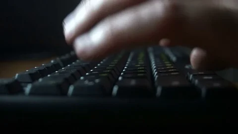 Human hands working on the keyboard,dark room Stock Footage 77166322