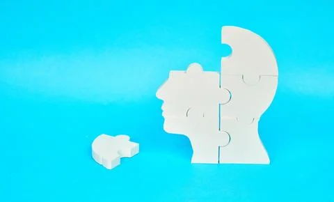 Human head puzzle with missing piece symbolizing memory challenges Stock Photos