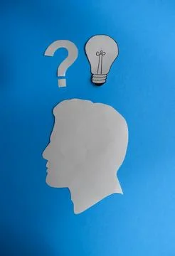 Human Head with Question Mark and Idea Light Bulb Stock Photos
