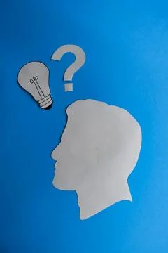Human Head with Question Mark and Idea Light Bulb Stock Photos
