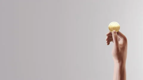 Human Holding Bitcoin on White Background 库存影片 169241863