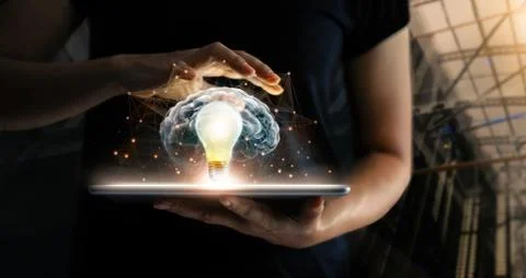 Human holding tablet with light bulb future technology, brain and network 스톡 사진
