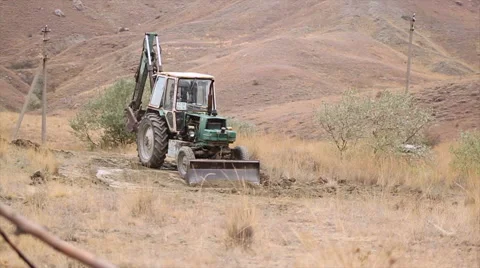 Human invasion of the pristine nature of the tractor Stock Footage 60247862