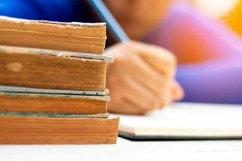 Human learning and writing with book Stock Photos