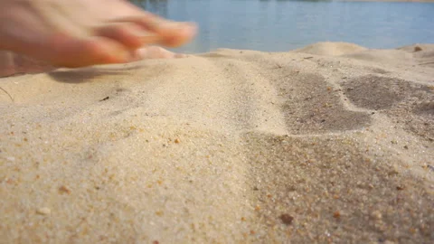 Human legs walking along the sandy shore. Stock Footage 111390773