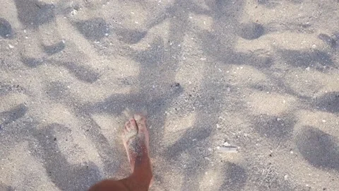 Human legs walking on the sand Stock Footage 87948797