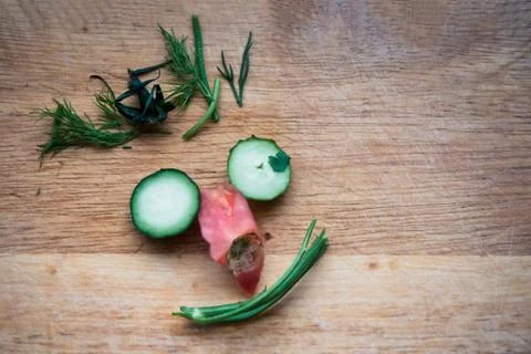 Human nthropomorphic Face Made Up Of Vegetable pruning on wooden board Stock Photos