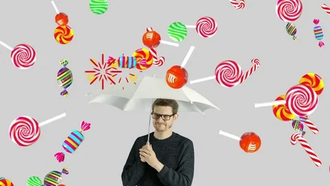 Human person man who do not like sweet candiesl ollipop chupa chups caramel Stock Footage 75231909