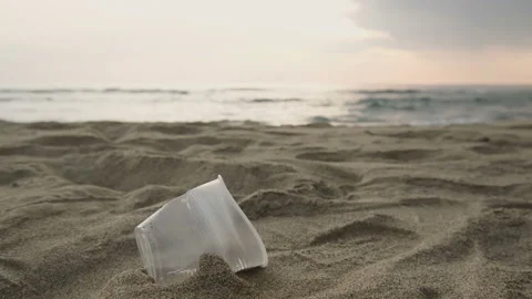 Human pick up plastic glass garbage on sea coast,clean up ecosystem pollution,4k Stock Footage 139720809