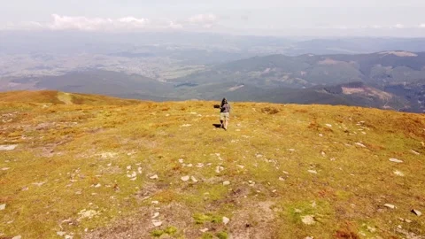 Human pilot with remote control outdoors in wild nature. Video stock 252942077