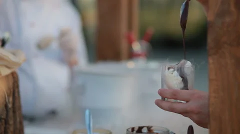 Human put chocolate on nitrogen iceacream Stock Footage 68191600