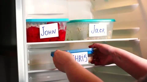 Human putting lunch box in office refrigerator. Office lunch containers with  Stock Footage 312624165