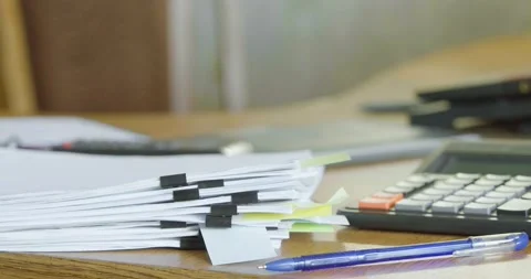 Human putting a stack of sheets on a desk at the office. A lot of work. Video stock 236293845