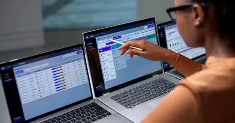 Human Resource Manager Schedules Interviews Using Laptop And Checklist Effici Stock Photos